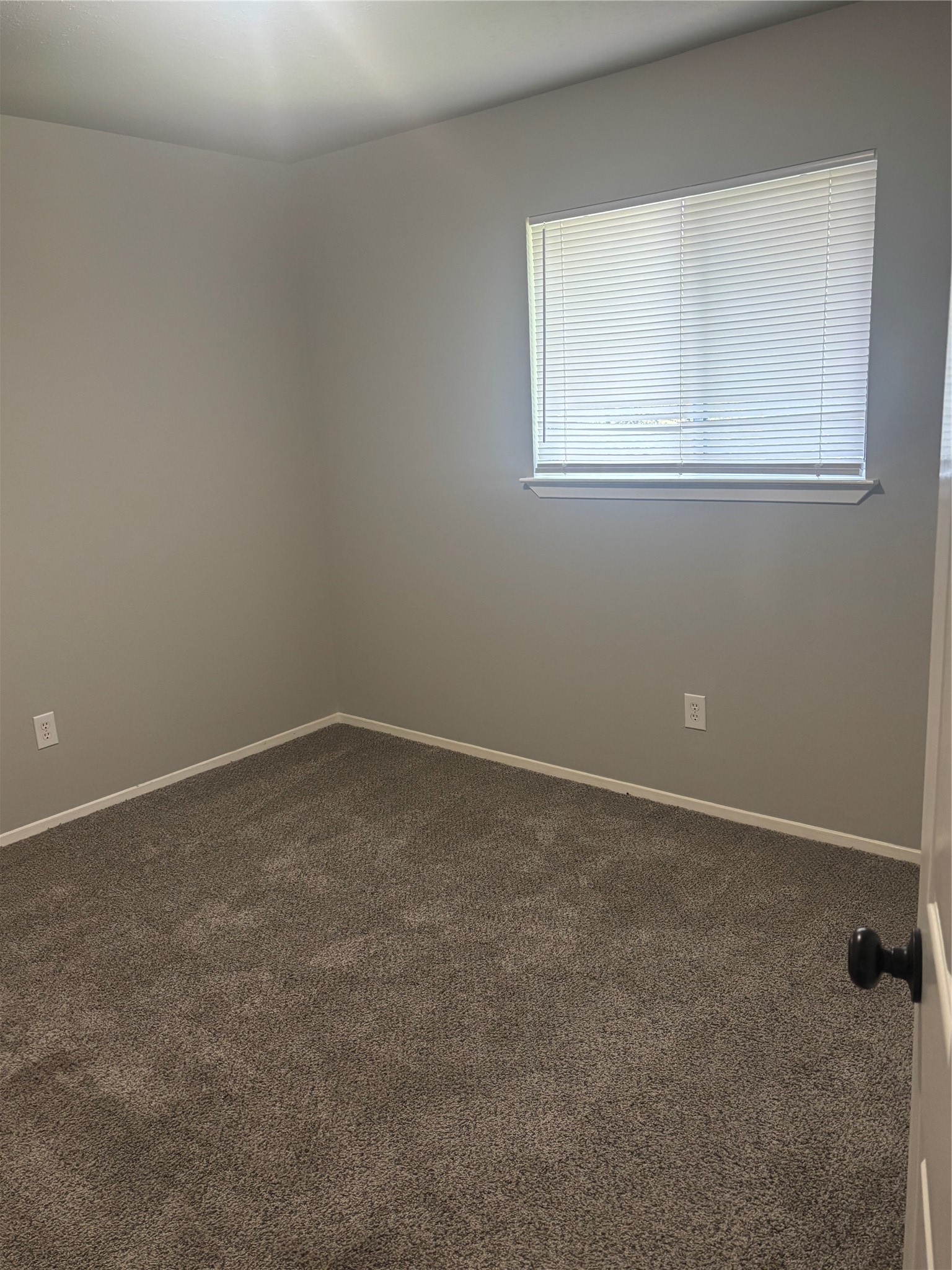 73 South Waxberry Road The Woodlands, TX 77381 - Photo 11 of 23 an empty room with a window