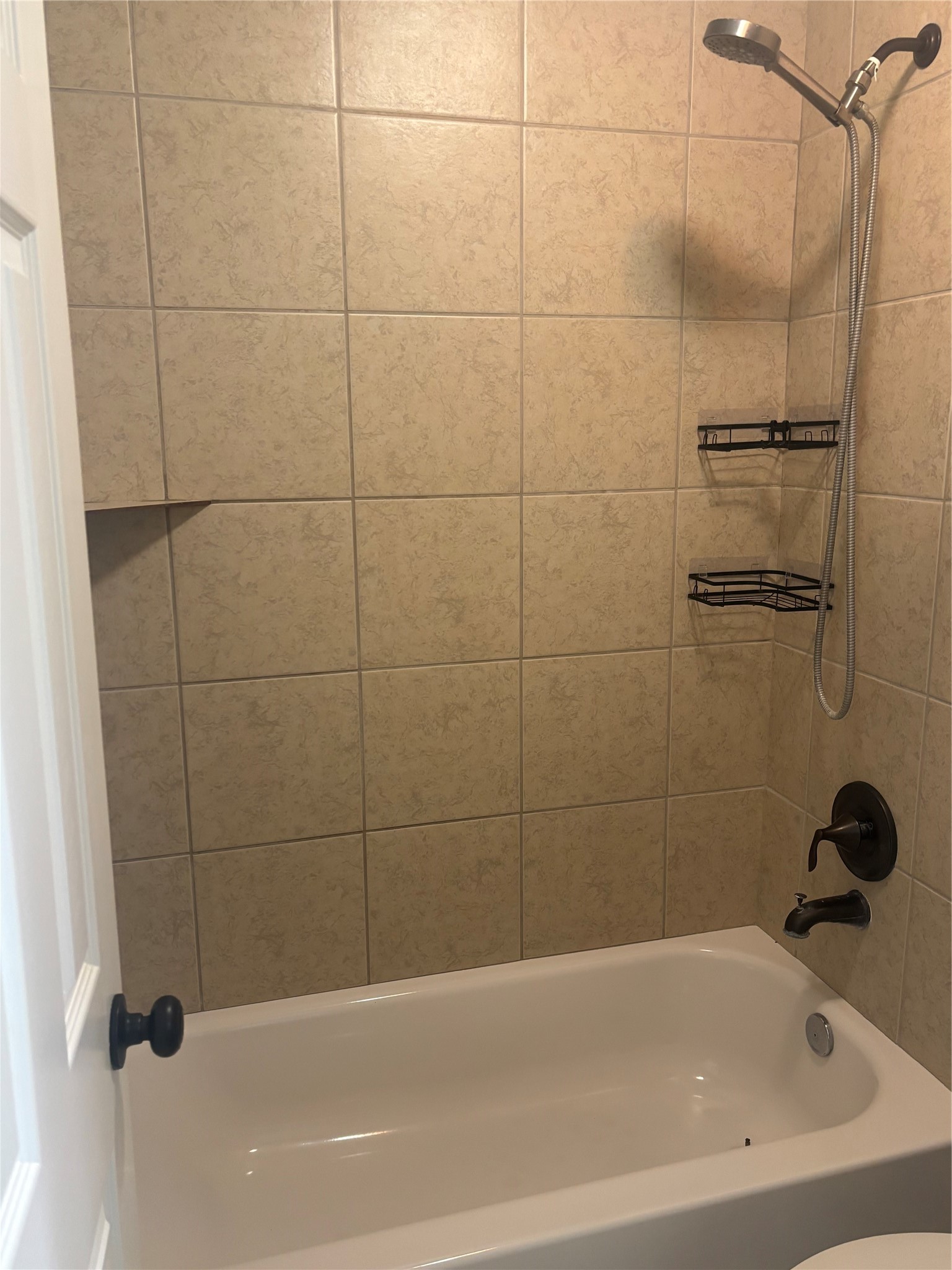 73 South Waxberry Road The Woodlands, TX 77381 - Photo 19 of 23 a bathroom with a bathtub