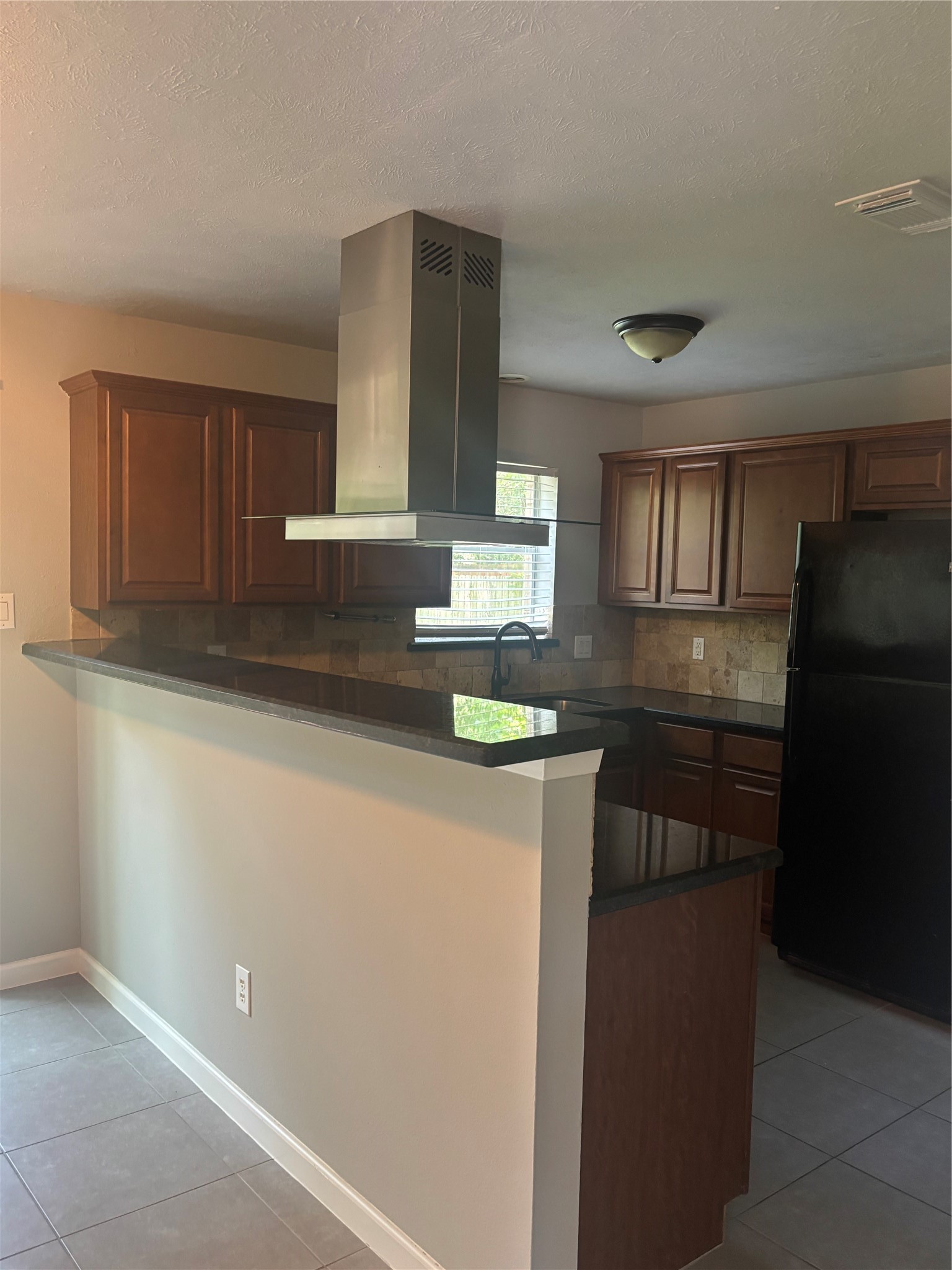 73 South Waxberry Road The Woodlands, TX 77381 - Photo 22 of 23 a kitchen with granite countertop a refrigerator a stove and a sink