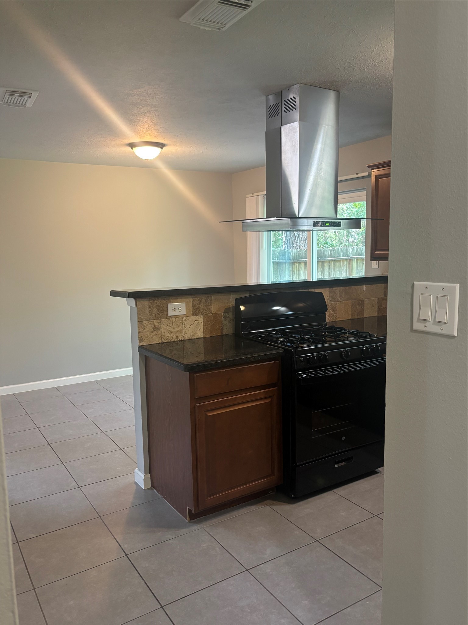 73 South Waxberry Road The Woodlands, TX 77381 - Photo 23 of 23 a kitchen with a cabinets and window