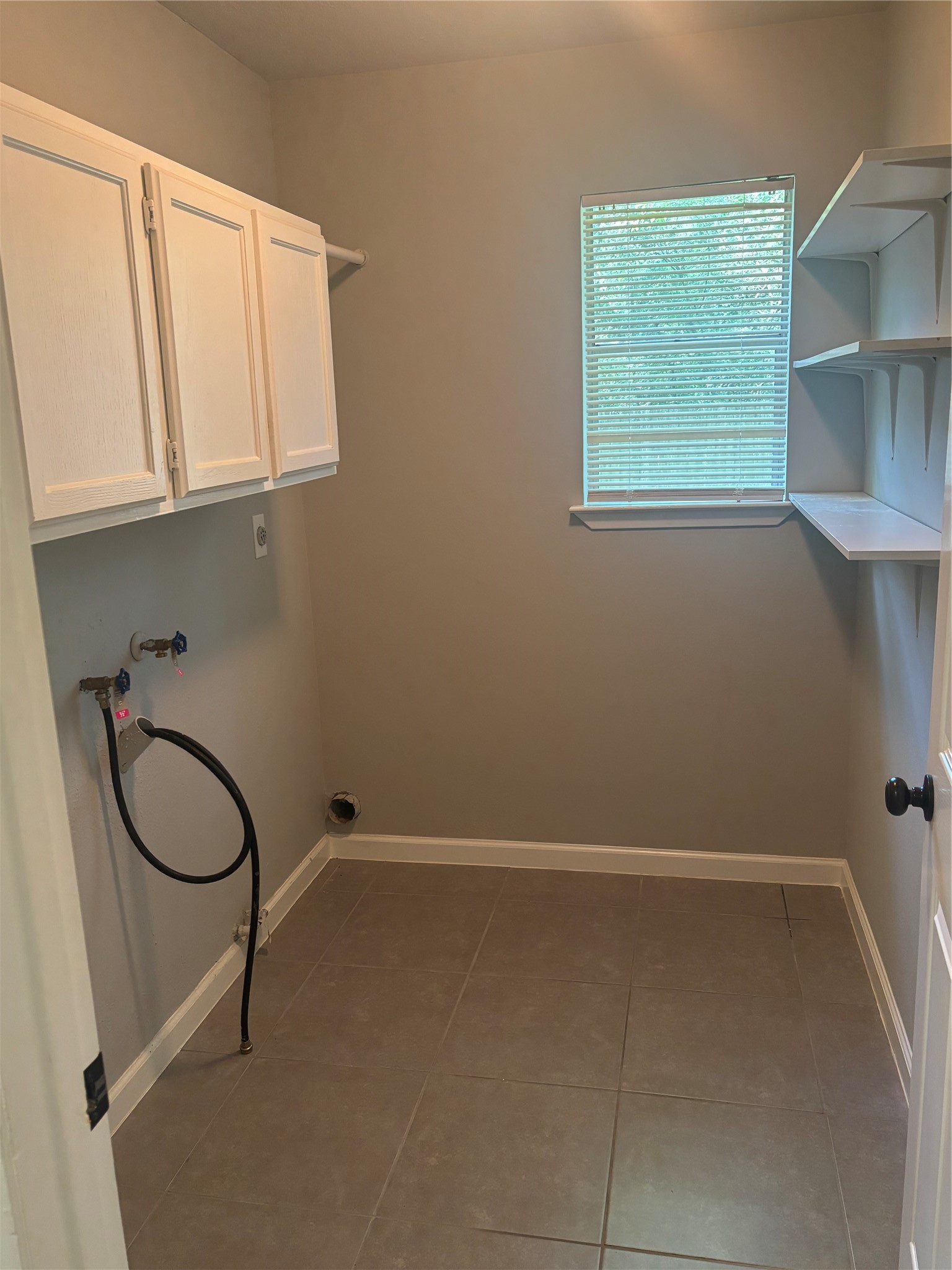 73 South Waxberry Road The Woodlands, TX 77381 - Photo 5 of 23 a bathroom with a granite countertop sink and a window