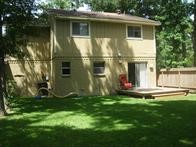 73 South Waxberry Road The Woodlands, TX 77381 - Photo 7 of 8 a front view of a house with a yard