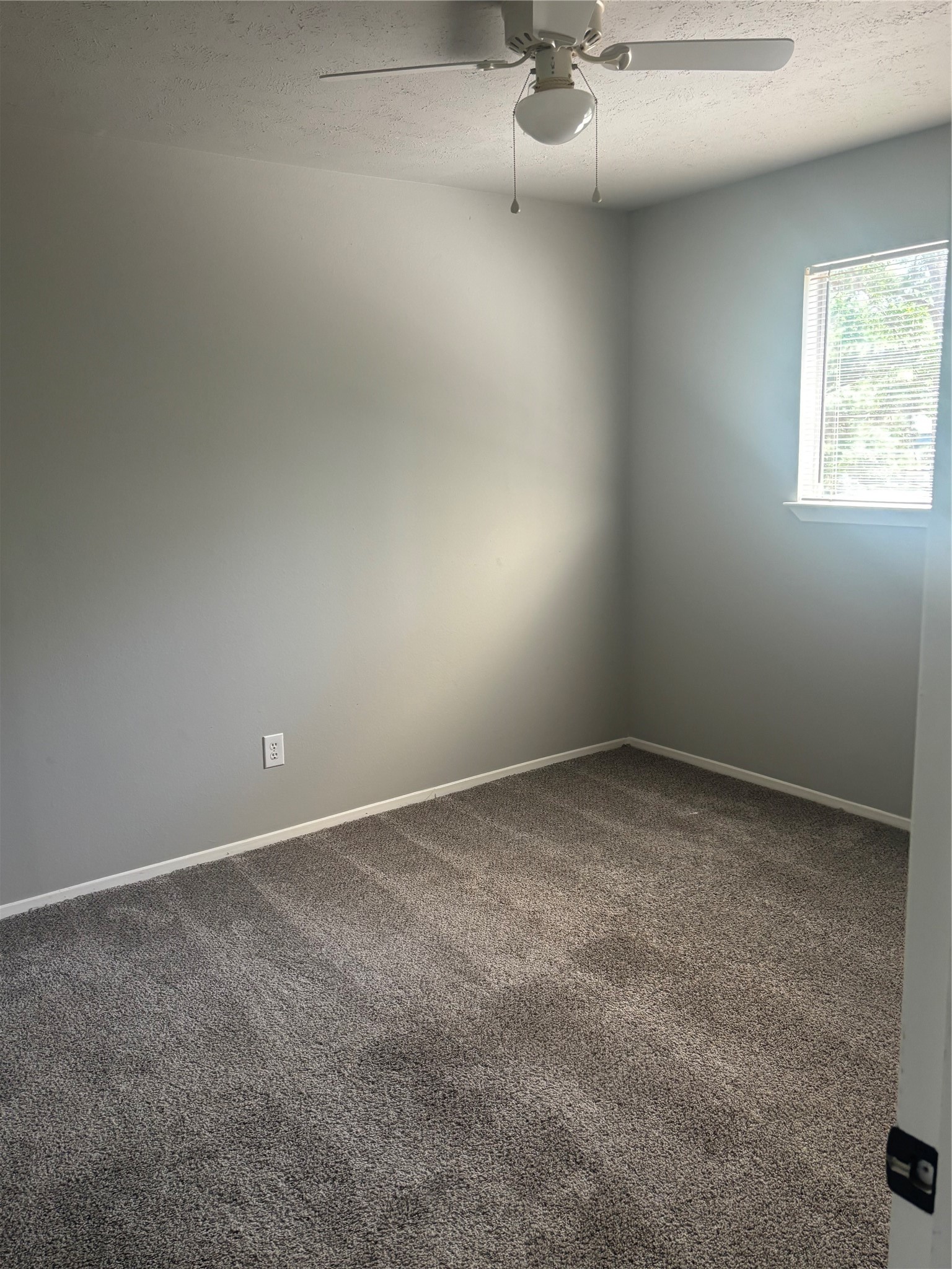 73 South Waxberry Road The Woodlands, TX 77381 - Photo 9 of 23 a view of a room with window