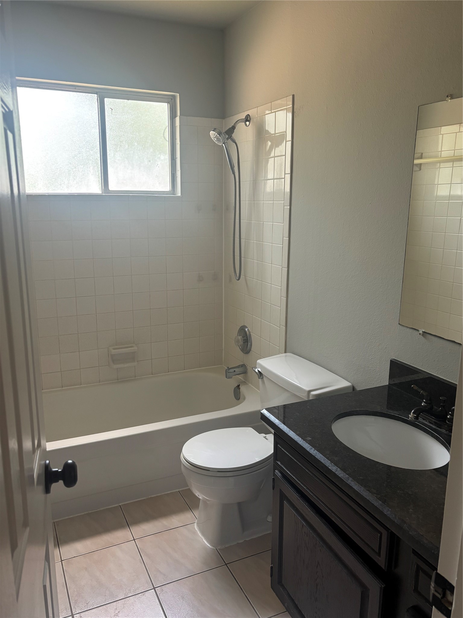 73 South Waxberry Road The Woodlands, TX 77381 - Photo 10 of 23 a bathroom with a granite countertop toilet a sink and a mirror