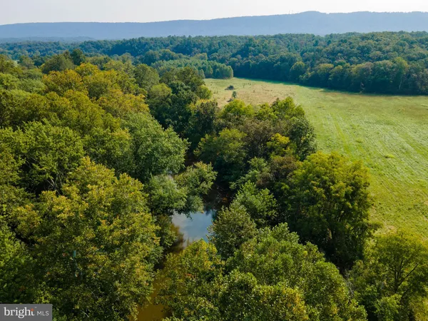 a view of lake with mountain in the background