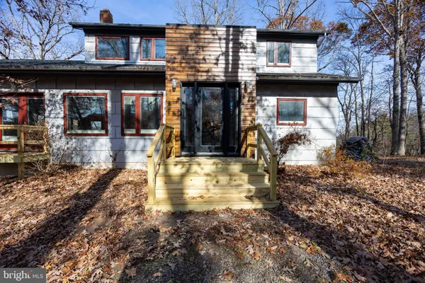 a view of a large house with a street