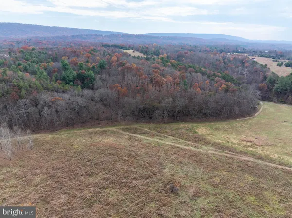 a kitchen with stainless steel appliances a stove a microwave and cabinets