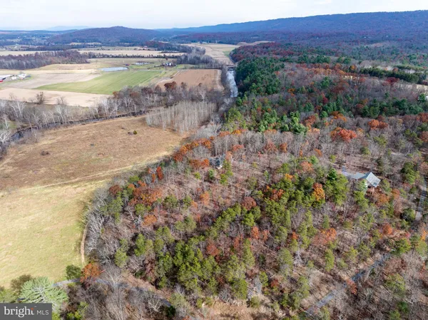 a bathroom with a toilet a sink and shower