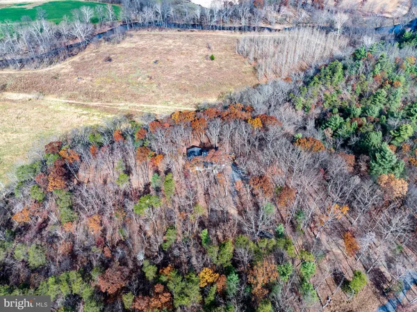 a room with pool table and windows