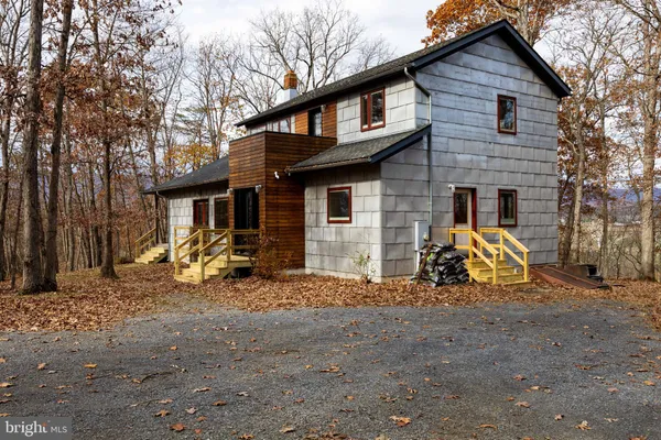 a view of a swimming pool with a yard