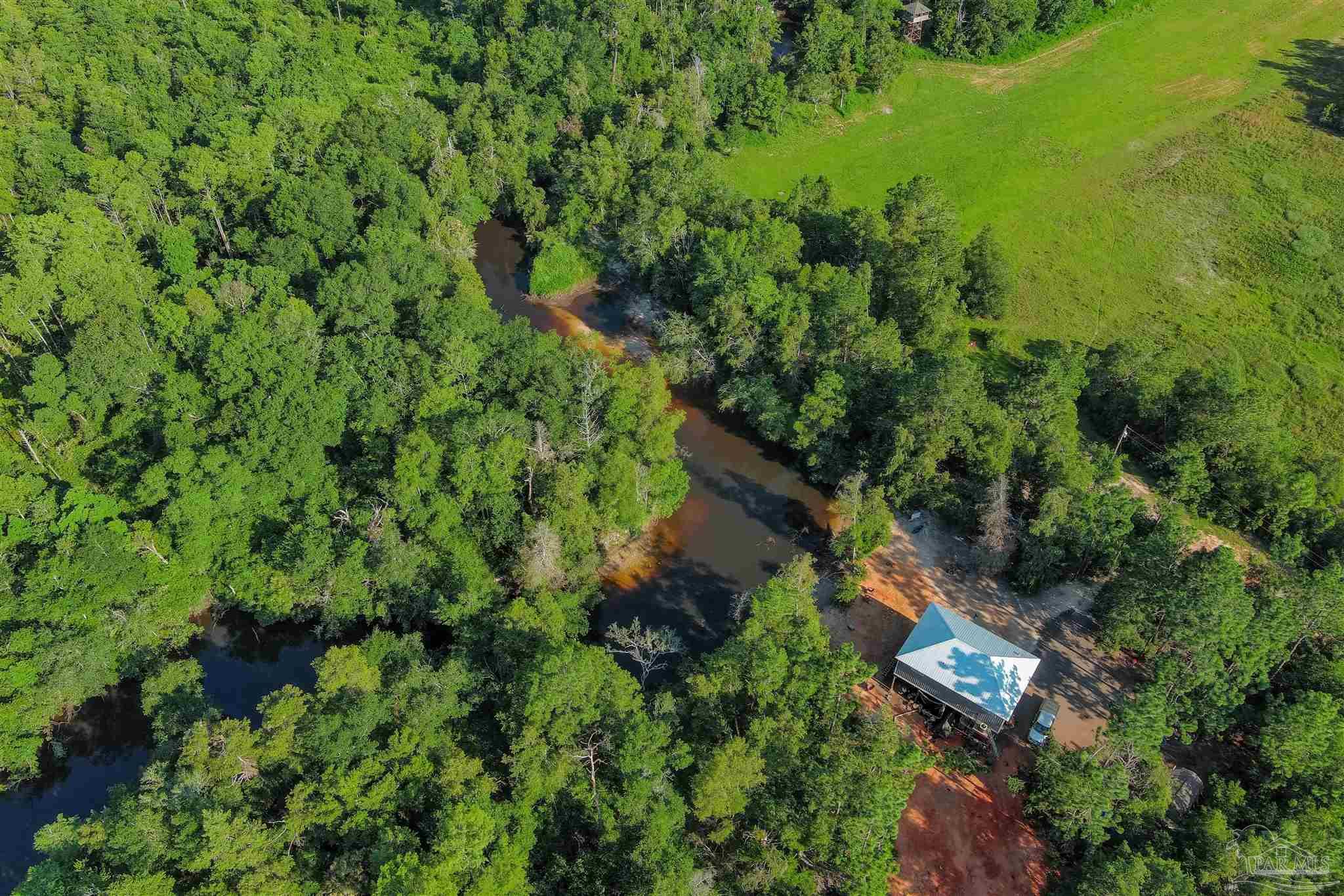19755 Vaughn Road Seminole, AL 36574 - Photo 29 of 45 an aerial view of residential house with outdoor space and trees all around