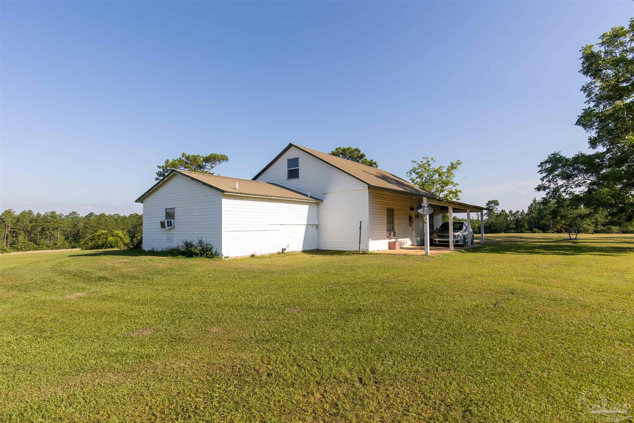 19755 Vaughn Road Seminole, AL 36574 - Photo 3 of 45 a front view of house with yard and ocean