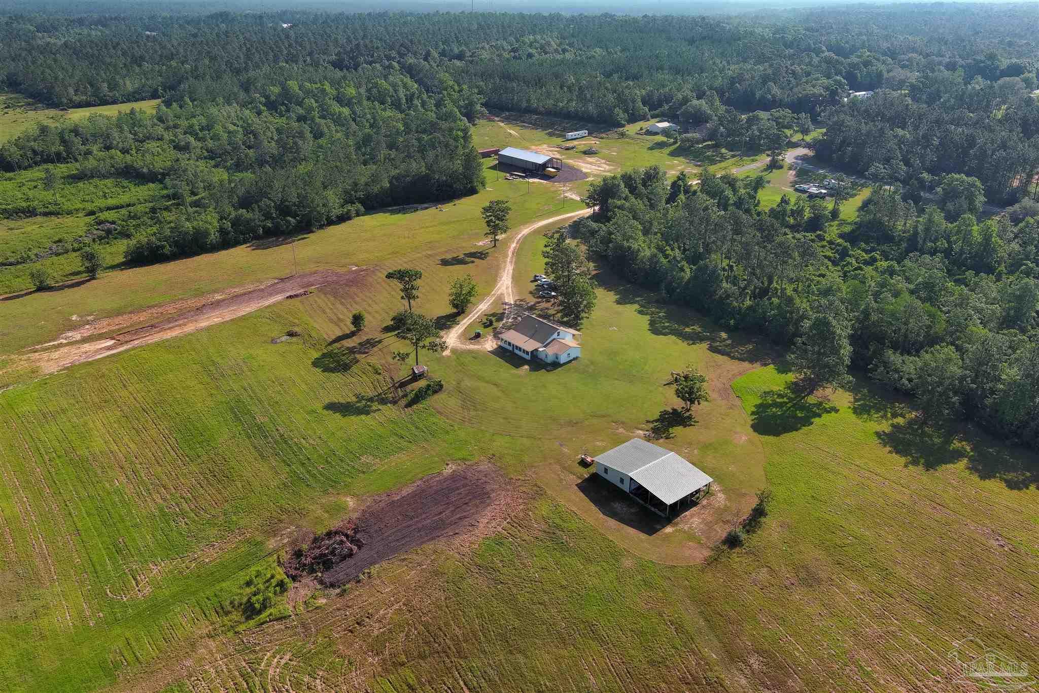 19755 Vaughn Road Seminole, AL 36574 - Photo 38 of 45 an aerial view of a house with a yard basket ball court and outdoor seating