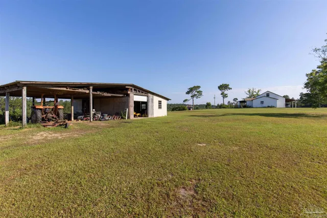 a view of a house with outdoor space and sitting area