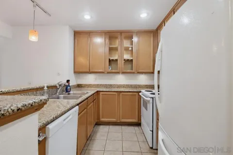 a kitchen with a sink and a refrigerator
