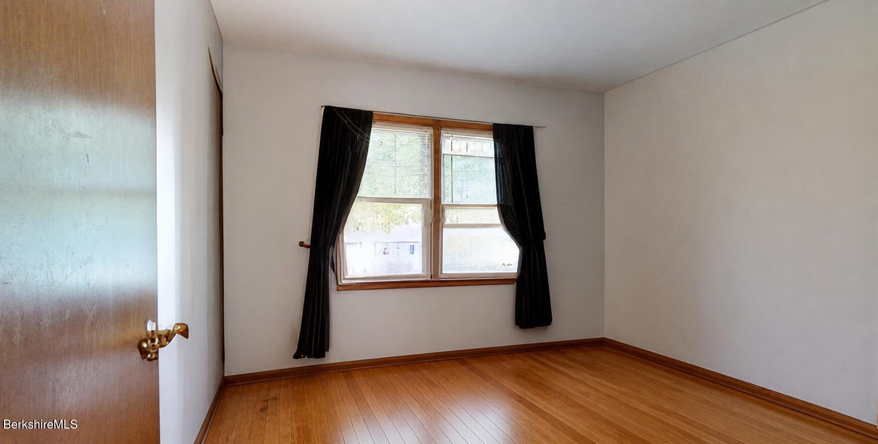 16 Anthony Street Adams, MA 01220 - Photo 16 of 33 an empty room with wooden floor and windows