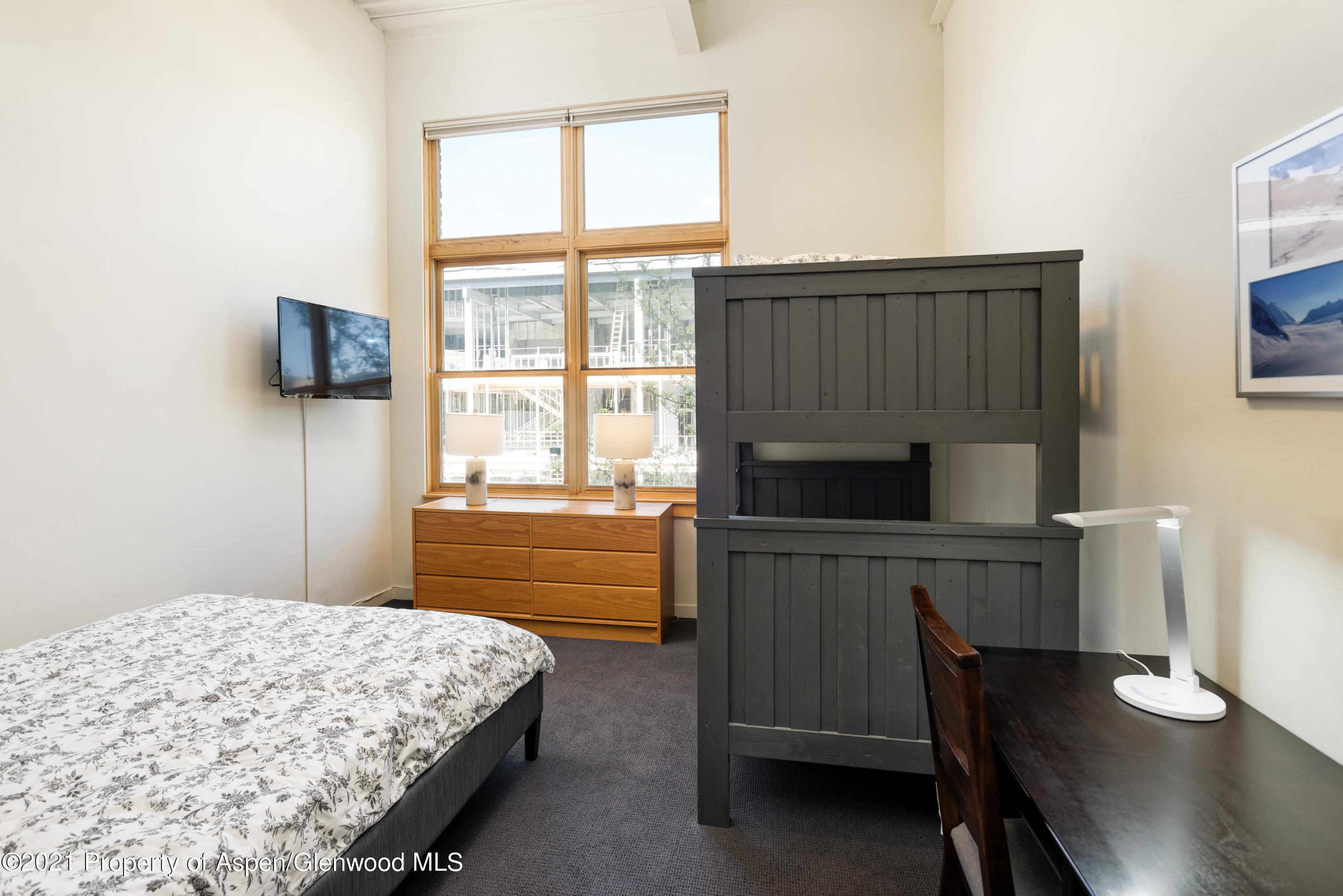 231 Robinson Street, Unit R212 Basalt, CO 81621 - Photo 12 of 14 a bedroom with a bed and a television