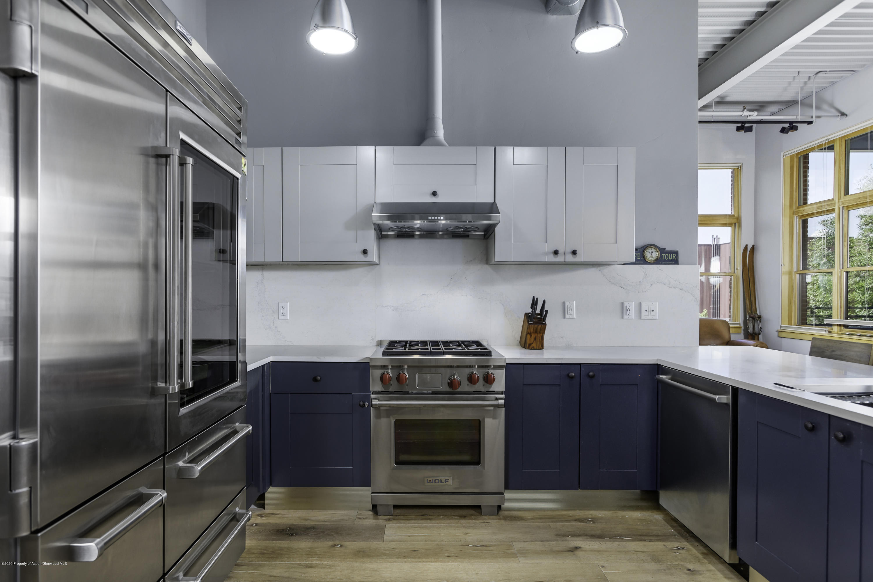 231 Robinson Street, Unit R212 Basalt, CO 81621 - Photo 4 of 14 a kitchen with a stove and a refrigerator
