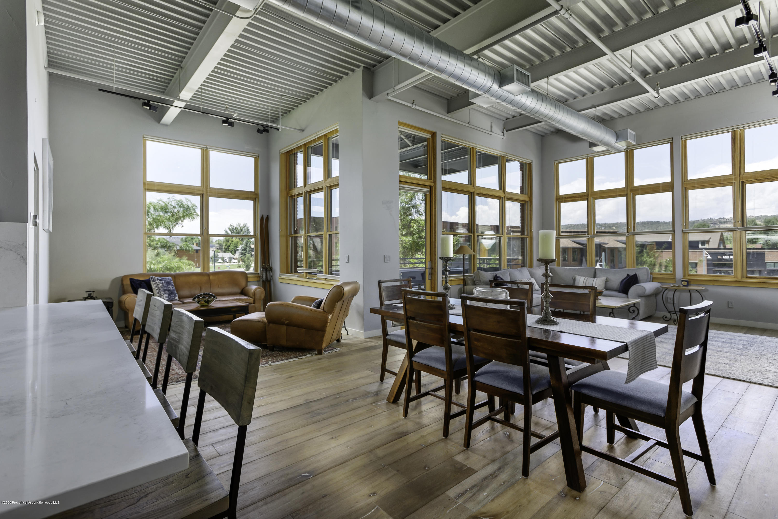 231 Robinson Street, Unit R212 Basalt, CO 81621 - Photo 5 of 14 a dining room with furniture window and wooden floor
