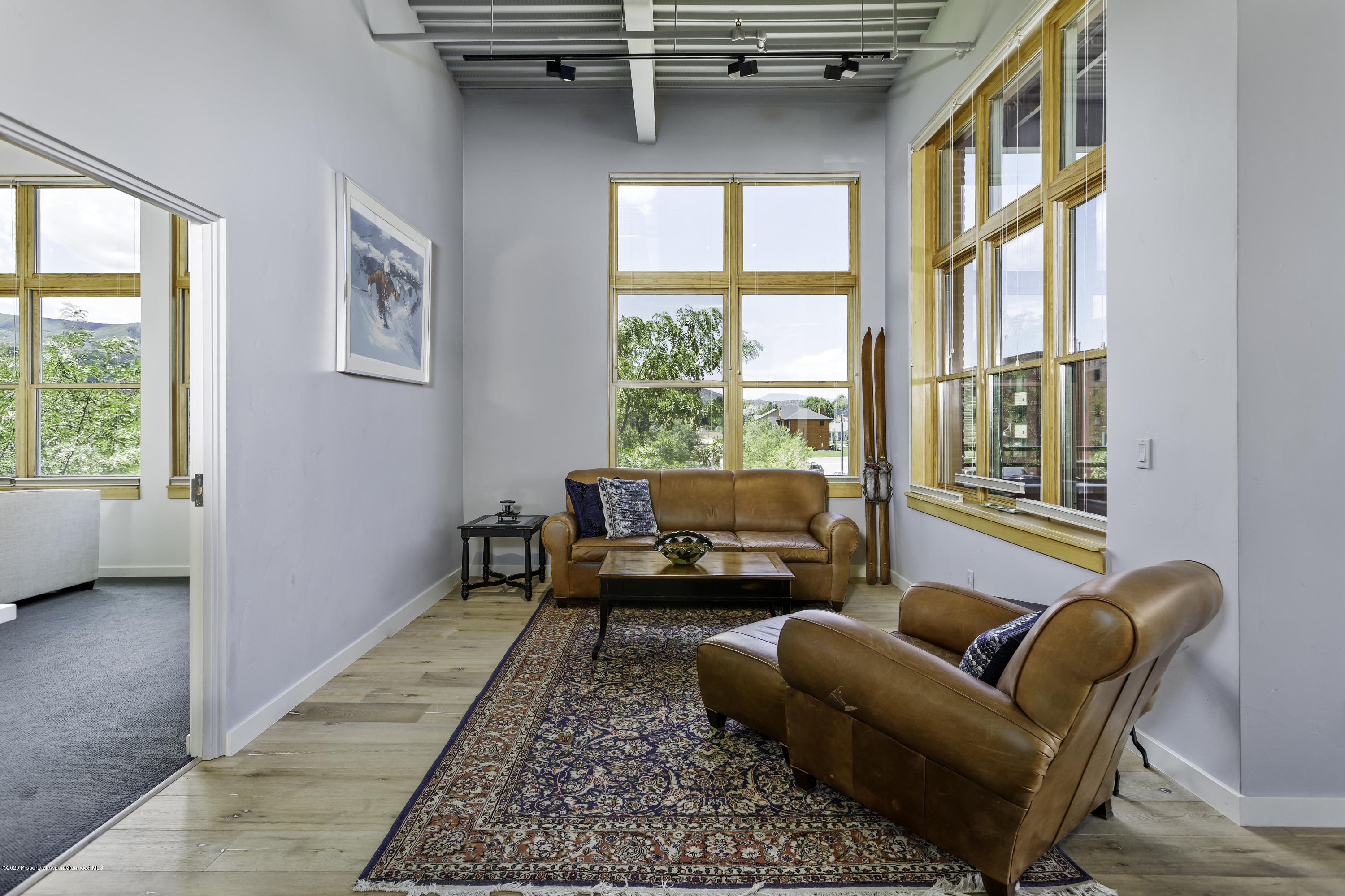 231 Robinson Street, Unit R212 Basalt, CO 81621 - Photo 6 of 14 a living room with furniture and a large window