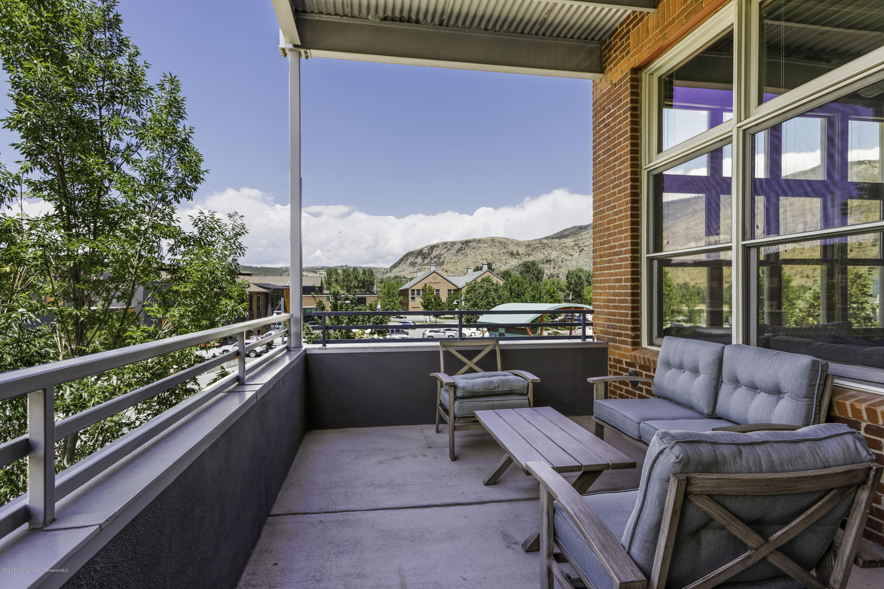 231 Robinson Street, Unit R212 Basalt, CO 81621 - Photo 7 of 14 a view of balcony with outdoor seating and city view
