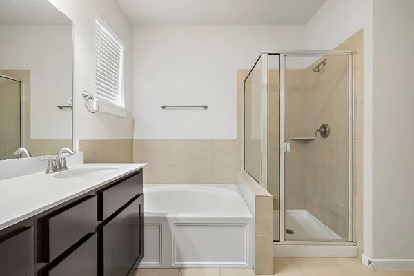 a bathroom with a shower and a sink