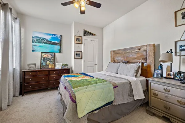 a bedroom with a bed and a dresser