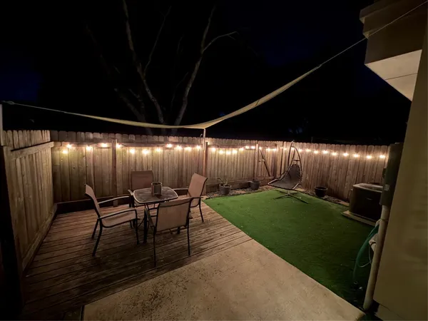 a view of a porch with furniture and yard