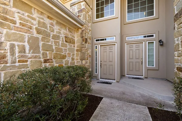 a view of a building with entryway windows