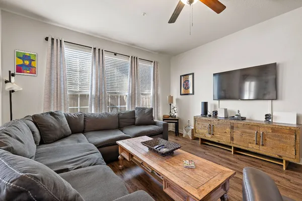 a living room with furniture and a flat screen tv