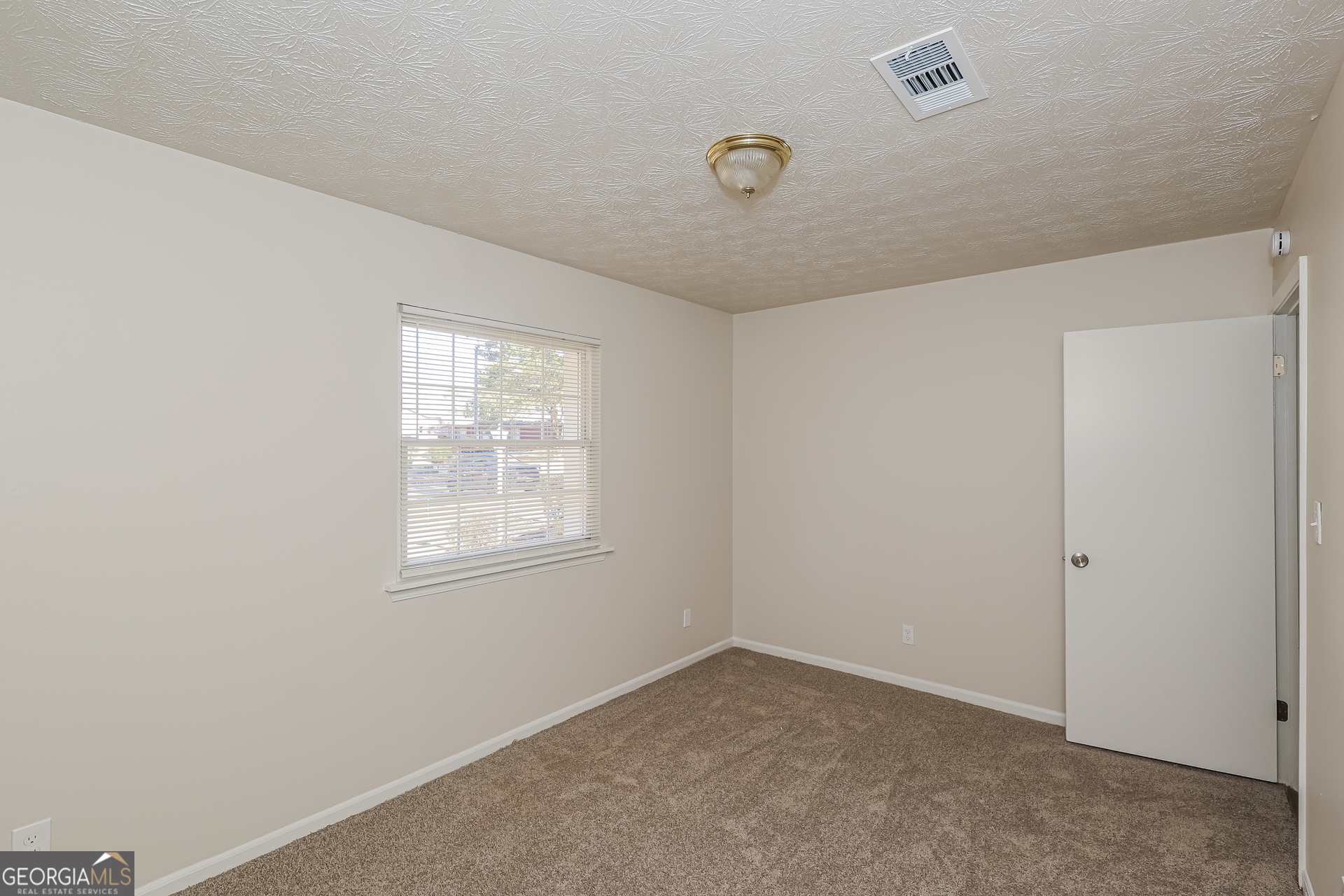 295 Adena Lane West South Fulton, GA 30349 - Photo 12 of 16 an empty room with a window