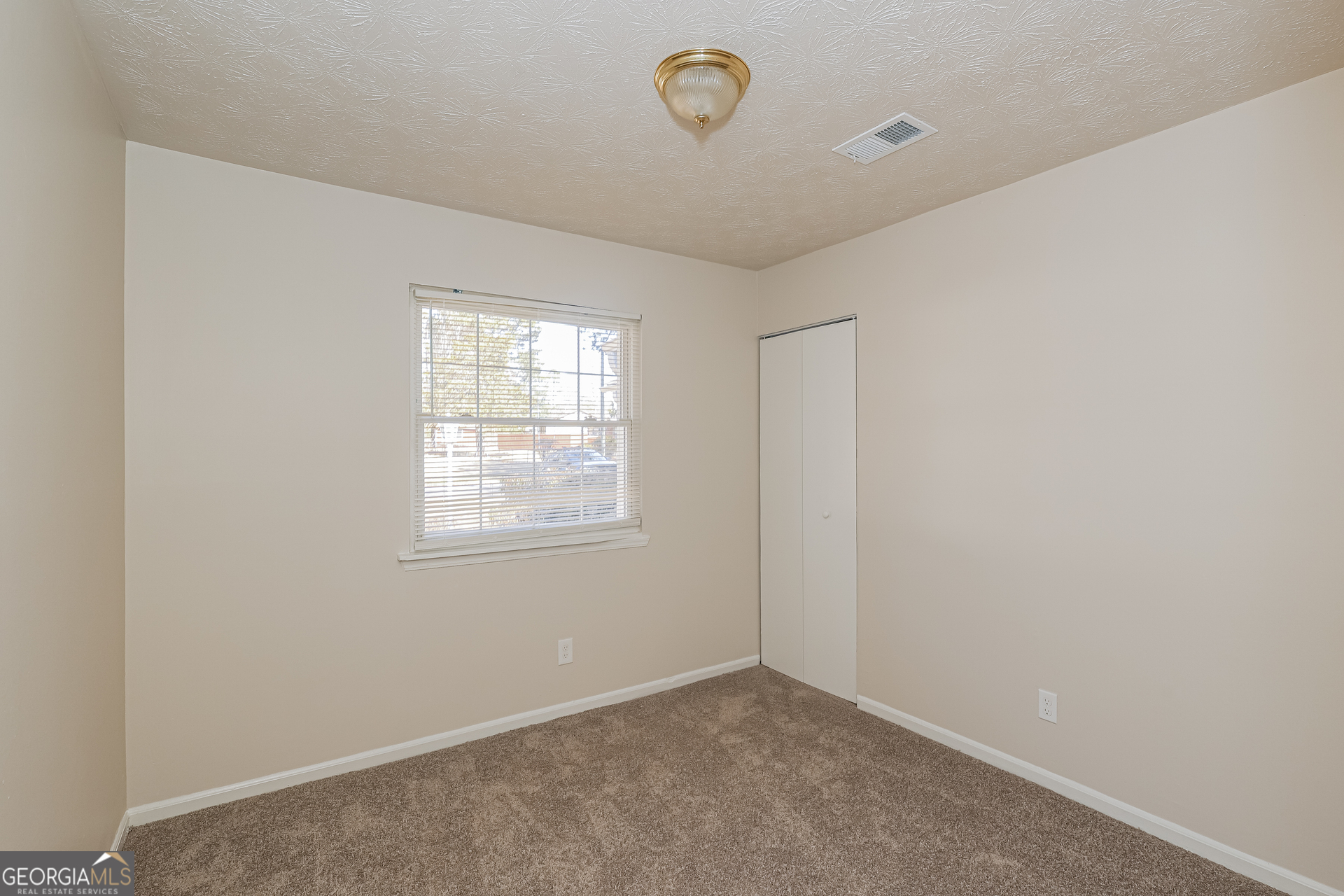 295 Adena Lane West South Fulton, GA 30349 - Photo 13 of 16 an empty room with a window