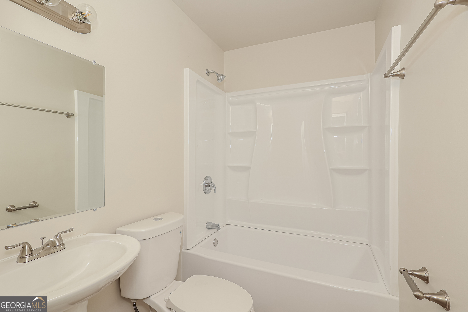 295 Adena Lane West South Fulton, GA 30349 - Photo 14 of 16 a bathroom with a sink toilet and a bathtub