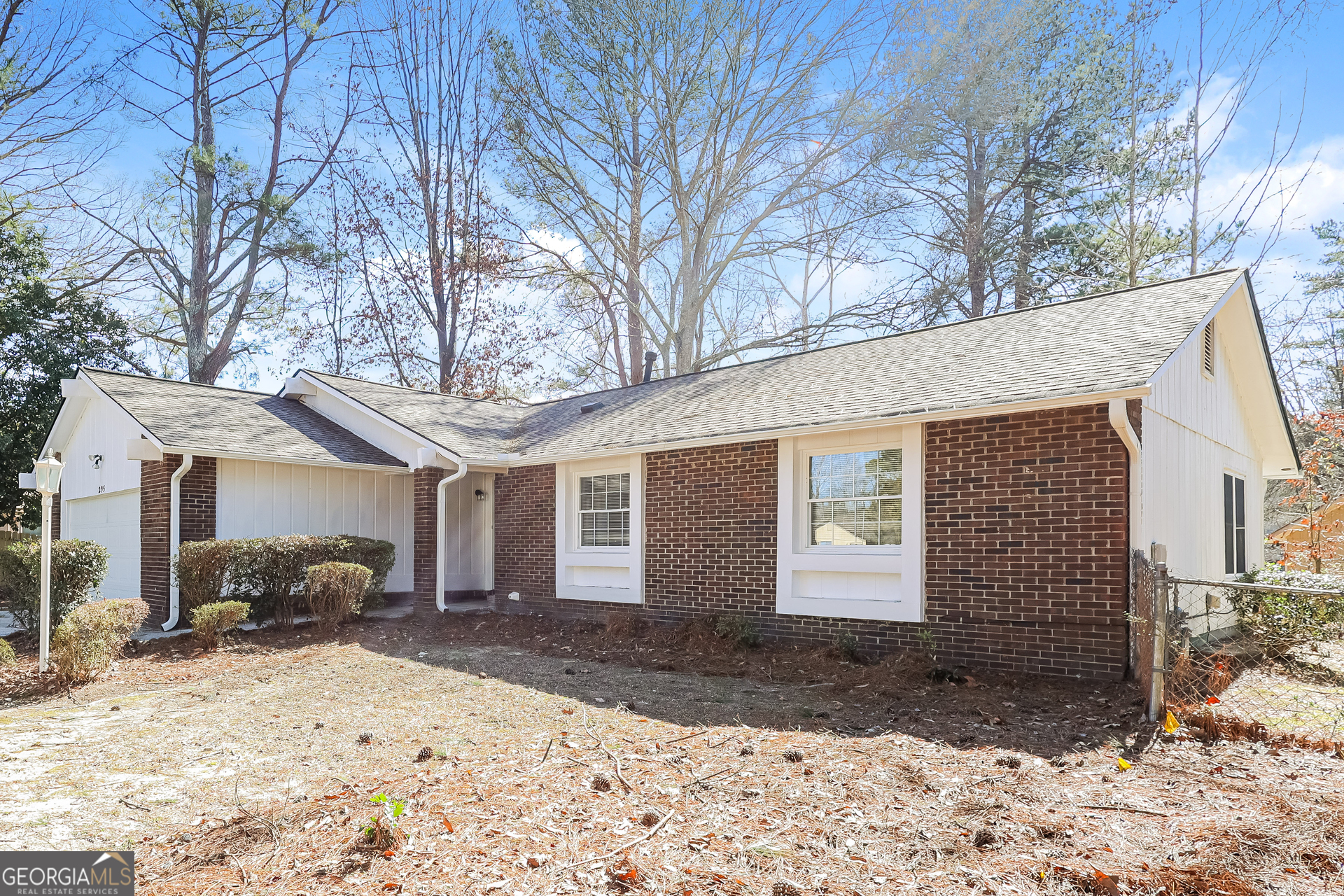 295 Adena Lane West South Fulton, GA 30349 - Photo 2 of 16 a front view of a house with a yard and garage