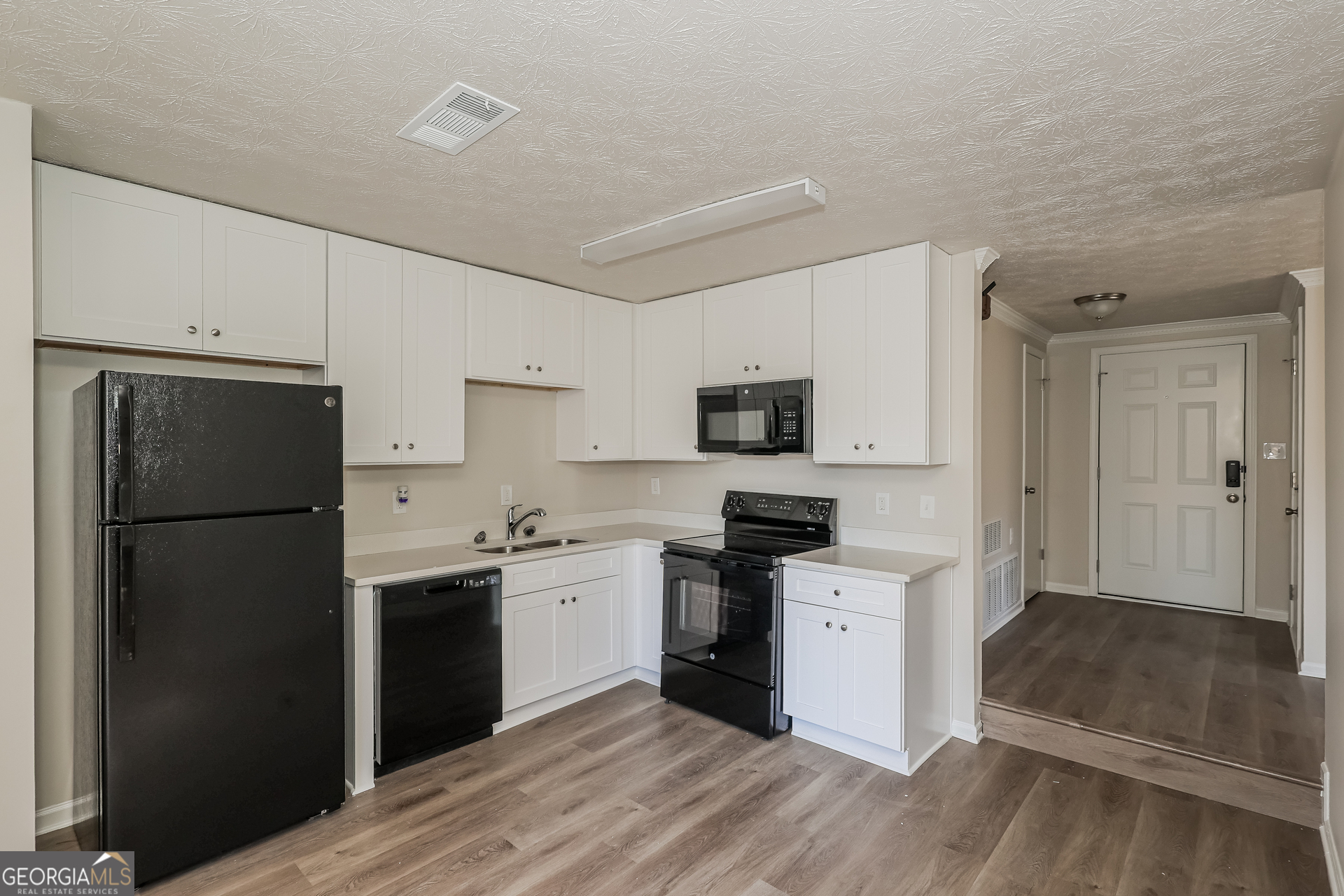 295 Adena Lane West South Fulton, GA 30349 - Photo 7 of 16 a kitchen with stainless steel appliances a refrigerator stove and sink