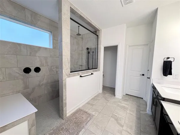 a bathroom with a sink and mirror