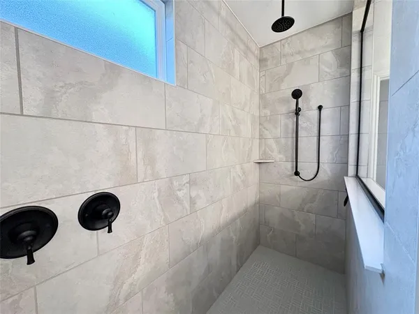 a kitchen with a refrigerator and sink