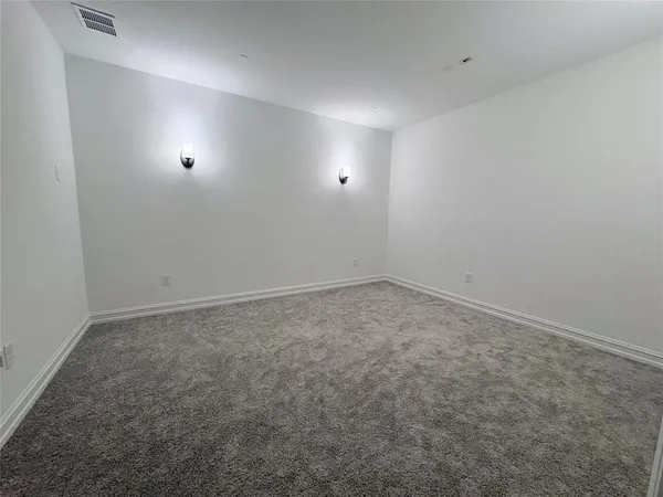 a bathroom with a toilet sink and shower