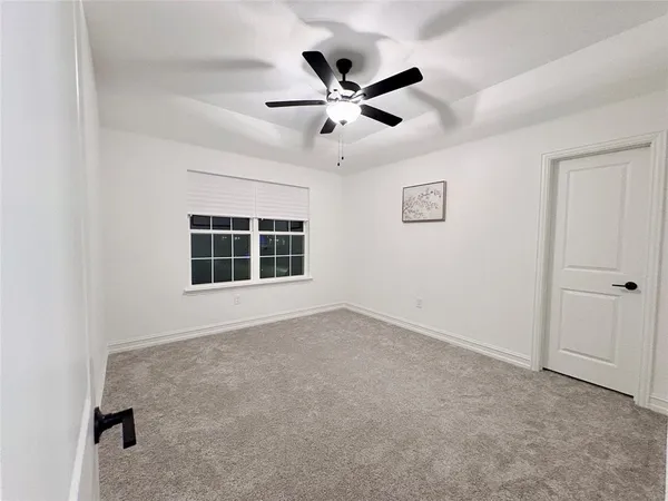 a bed room with a bed and a chair