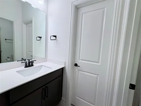 a bathroom with a toilet and a sink