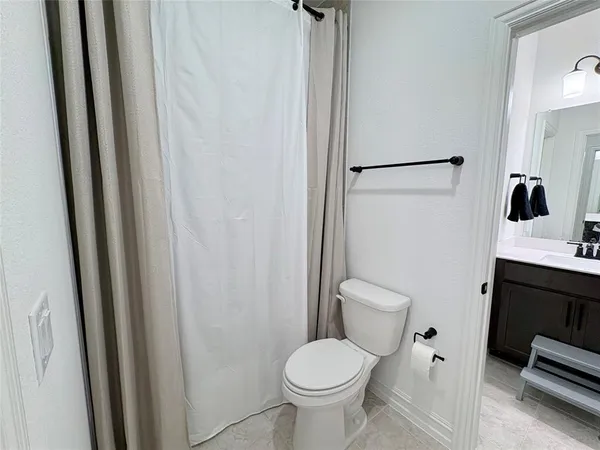 a bathroom with a sink vanity and mirror