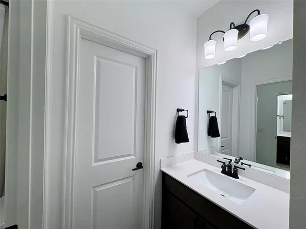 a bedroom with furniture and a flat screen tv
