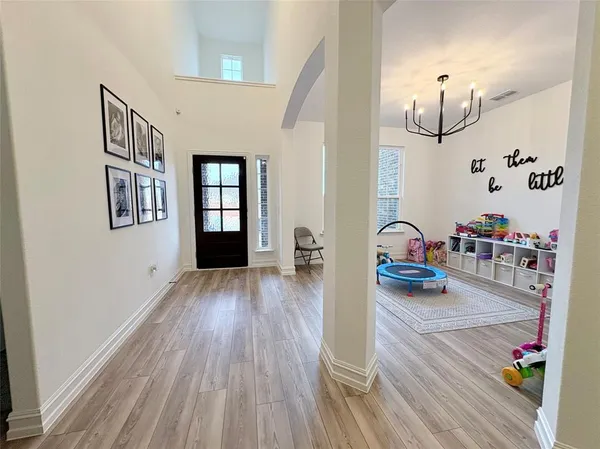 a view of a living room and hardwood floor