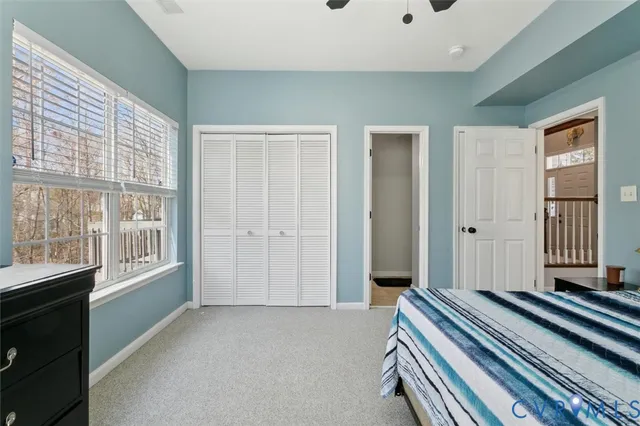 a living room with furniture a chandelier and a flat screen tv