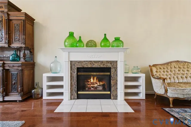 a living room with furniture a table and a chandelier