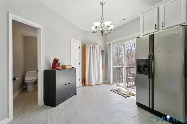 a living room with furniture a ceiling fan and a rug