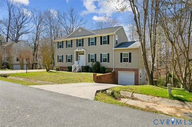 a view of a pathway with flower garden