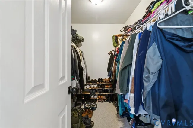 a utility room with dryer washer and a fridge