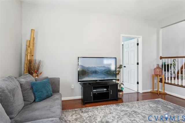 a spacious bedroom with a bed and a chandelier