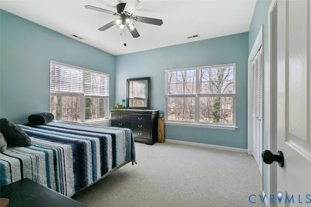 a bathroom with a sink a mirror and a shower curtain